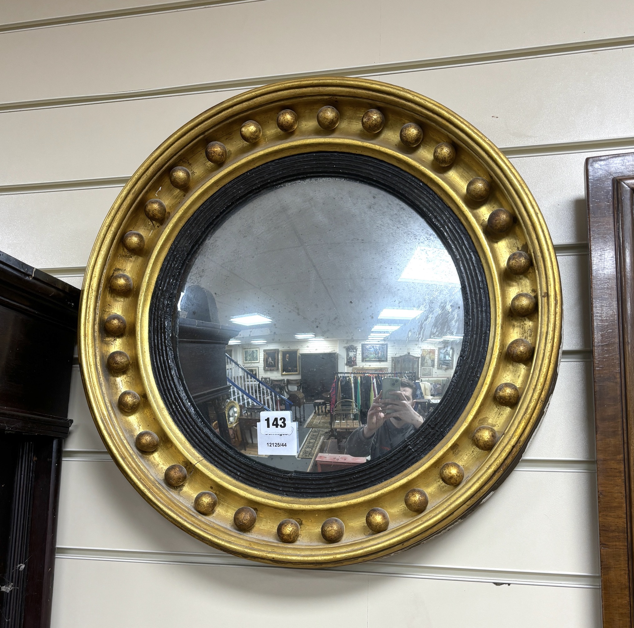 Two Regency style giltwood convex wall mirrors, larger diameter 45cm
